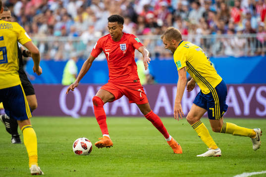 Jesse Lingard of England and Sebastian Larsson of Sweden
