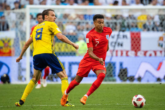 Albin Ekdal of Sweden and Jesse Lingard of England