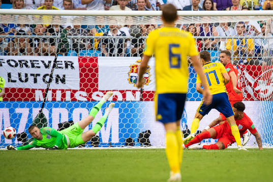 Goalkeeper Jordan Pickford of England saves a shot from