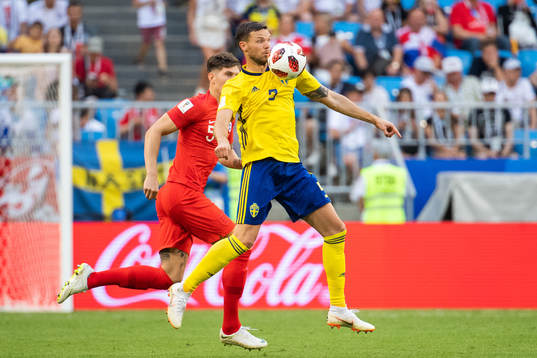 Marcus Berg of Sweden and John Stones of England