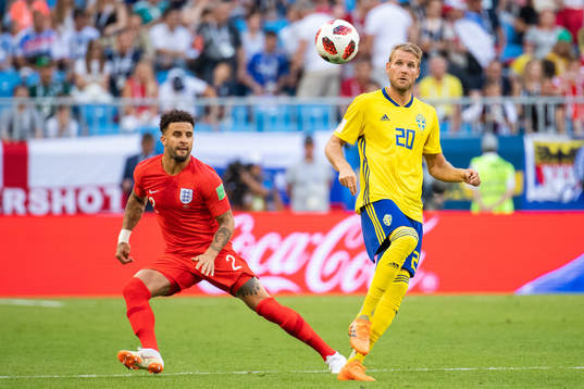 Kyle Walker of England and Ola Toivonen of Sweden