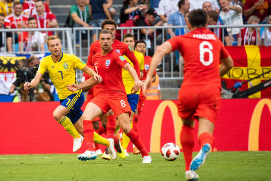 Sebastian Larsson of Sweden and Jordan Henderson of England