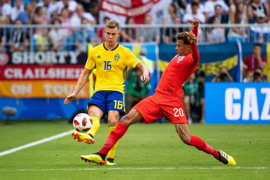 Emil Krafth of Sweden and Dele Alli of England