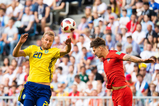 Ola Toivonen of Sweden and John Stones of England