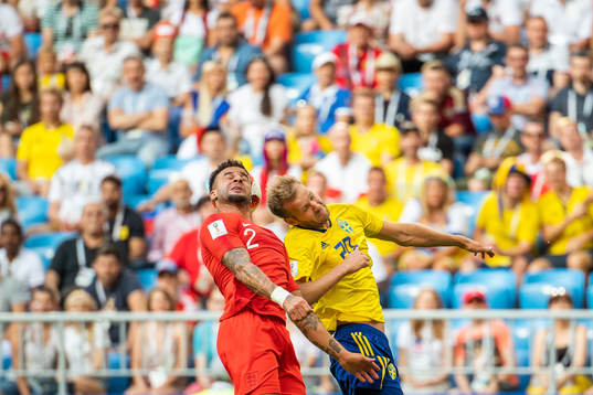 Kyle Walker of England and Ola Toivonen of Sweden