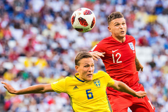 Ludwig Augustinsson of Sweden and Kieran Trippier of England