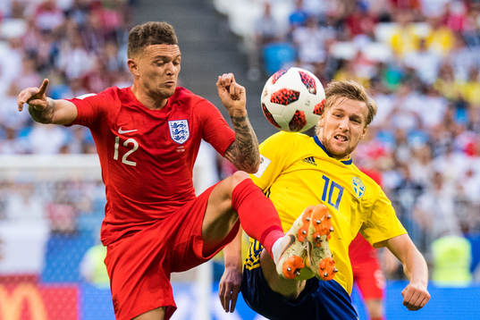 Kieran Trippier of England in action with Emil Forsberg of