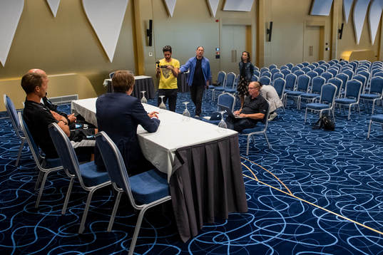 Journalists interview press officer Peter Åhlander, Markus