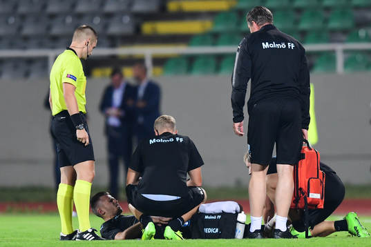 Arnór Ingvi Traustason of Malmö FF receives treatment
