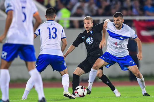 Oscar Lewicki of Malmö FF competes for the ball with Bujar