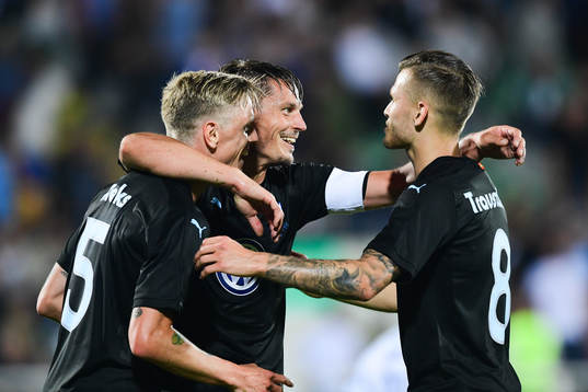 Sören Rieks celebrates with Markus Rosenberg and Arnór