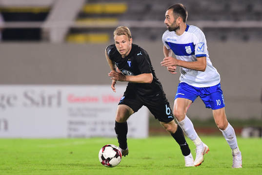 Oscar Lewicki  of Malmö FF and Xhevdet Shabani  of Drita