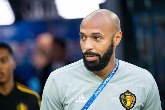 Assisting coach Thierry Henry of Belgium prior to the FIFA
