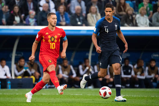 Eden Hazard of Belgium and Raphael Varane of France
