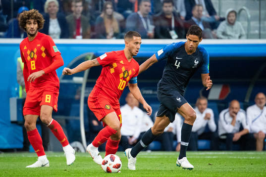Marouane Fellaini and Eden Hazard of Belgium competes for