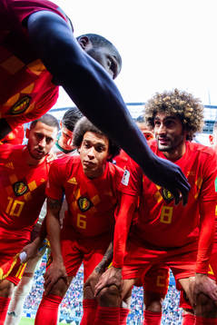 Romelu Lukaku talks to team mates Axel Witsel, Marouane
