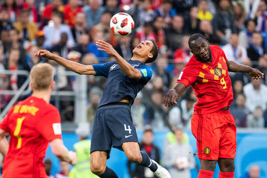 Raphael Varane of France and Romelu Lukaku of Belgium
