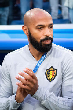 Assisting coach Thierry Henry of Belgium prior to the FIFA
