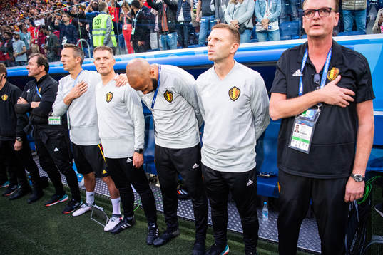 Assisting coach Thierry Henry (bows) of Belgium prior to