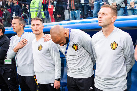 Assisting coach Thierry Henry (bows) of Belgium prior to