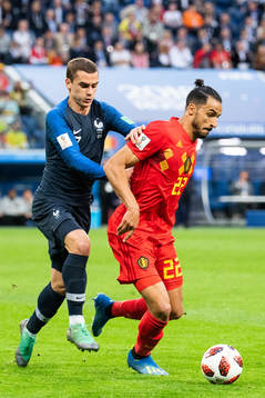 Antoine Griezmann of France competes for the ball with