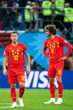 Eden Hazard and Marouane Fellaini of Belgium look dejected