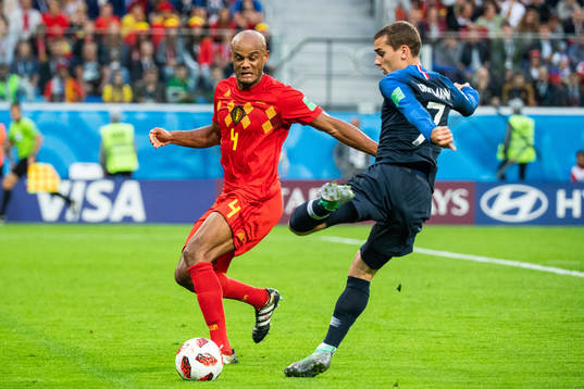 Vincent Kompany of Belgium and Antoine Griezmann of France