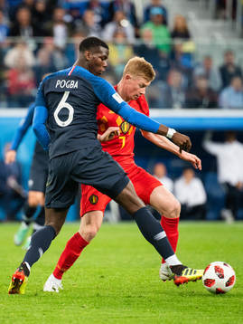 Paul Pogba of France and Kevin De Bruyne of Belgium