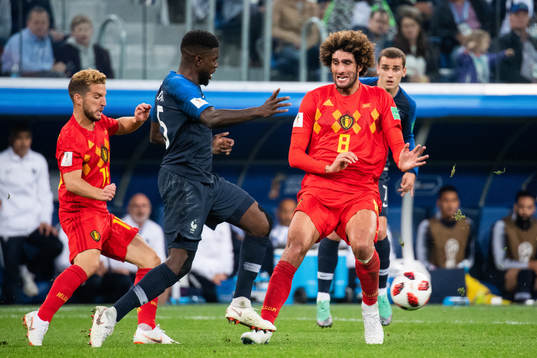 Samuel Umtiti of France and Marouane Fellaini of Belgium