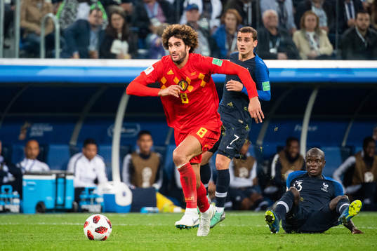 Marouane Fellaini Marouane Fellaini passes Ngolo Kante of