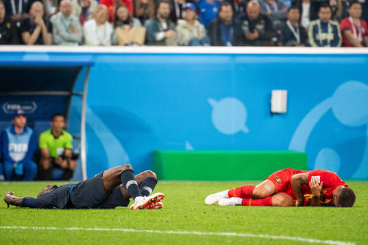 Blaise Matuidi of France and Eden Hazard of Belgium lies