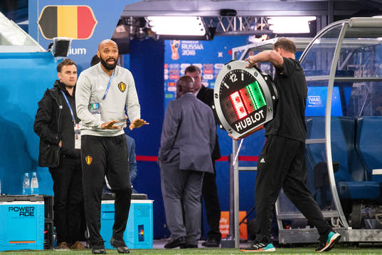 assisting coach Thierry Henry