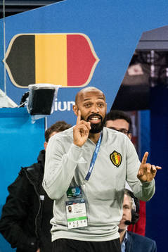 Assisting coach Thierry Henry of Belgium