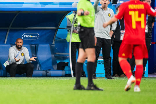 Assisting coach Thierry Henry of Belgium reacts