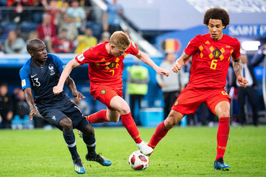 Ngolo Kante of France competes for the ball with Kevin De