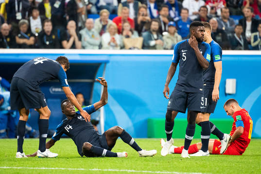 Blaise Matuidi of France and Eden Hazard of Belgium lies