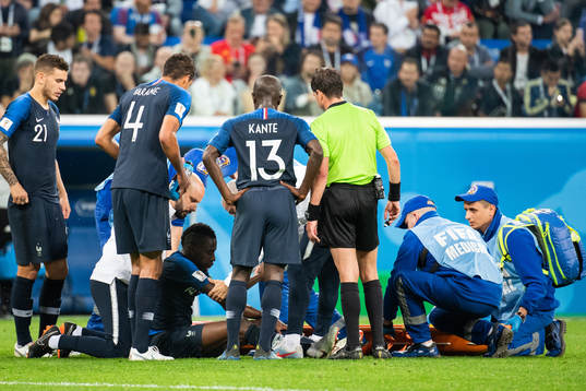 Blaise Matuidi of France and Eden Hazard of Belgium lies