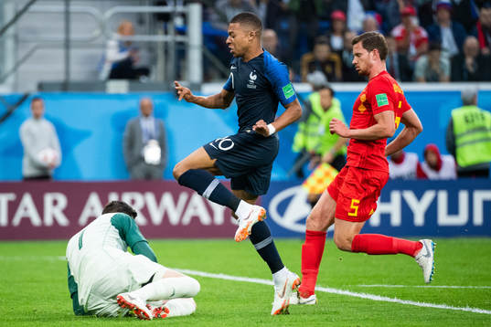 goalkeeper Thibaut Courtoisof Belgium saves in front of