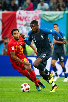 Paul Pogba of France and Moussa Dembele of Belgium