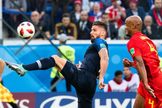 Olivier Giroud of France and Vincent Kompany of Belgium