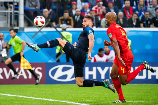Olivier Giroud of France and Vincent Kompany of Belgium