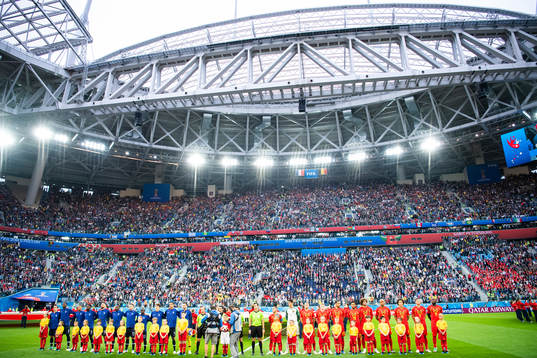 Plauers of France and of Belgium line up prior to the FIFA