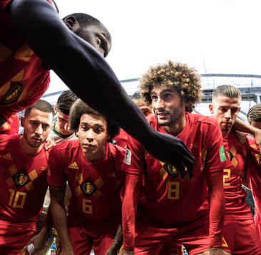 Romelu Lukaku talks to team mates Eden Hazard, Axel Witsel