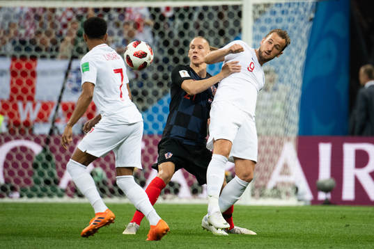 Domagoj Vida of Croatia and Harry Kane of England competes