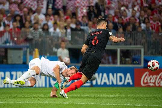 Harry Kane of England falls