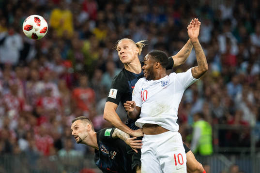 Mario Mandzukic and Domagoj Vida of Croatia competes for