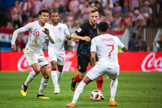 Dele Alli of England and Ivan Rakitic of Croatia