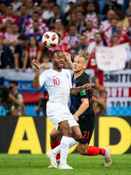 Raheem Sterling of England and Domagoj Vida of Croatia