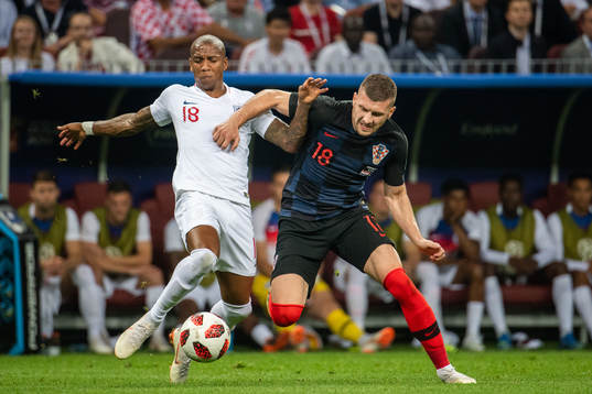 Ashley Young of England and Ante Rebic of Croatia competes
