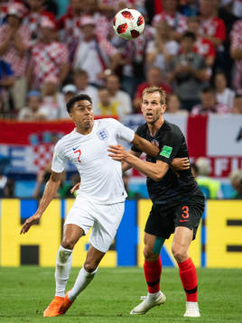 Jesse Lingard of England and Ivan Strinic of Croatia
